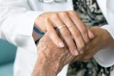 Doctor holding senior's hand