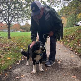 Male resident with his dog outside