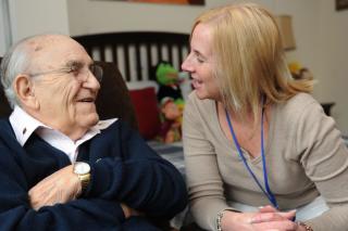 woman sitting with senior man