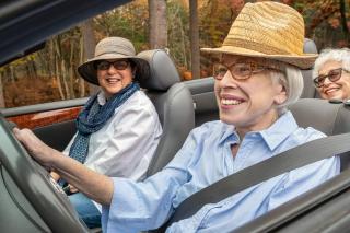 Older women driving in a convertible 