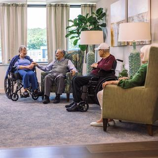 Long-term care patients sitting in a lounge area.