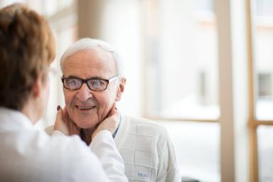 Woman doctor with older man