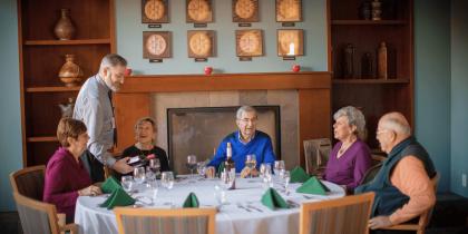 group of seniors sitting down to eat