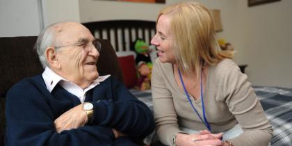 woman sitting with senior man