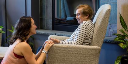 woman sitting with senior woman