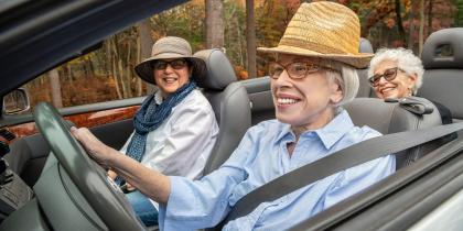 Older women driving in a convertible 