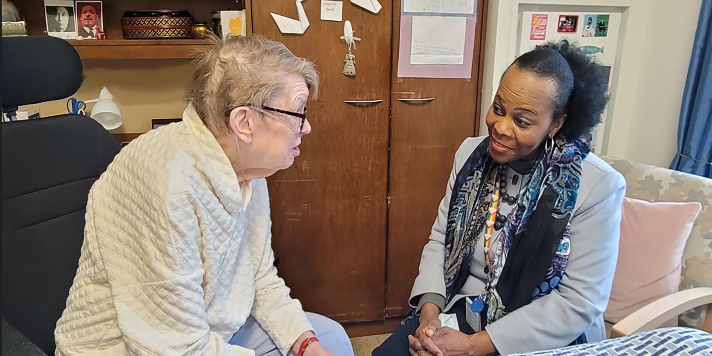 Woman sitting with senior woman