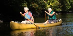 Two seniors in a canoe