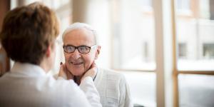 Woman doctor with older man