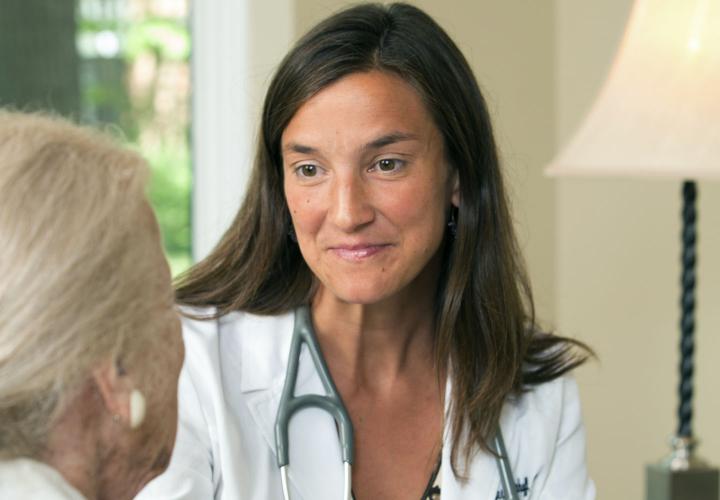 A geriatrician from Orchard Cove’s on-site primary care practice consults with a resident.