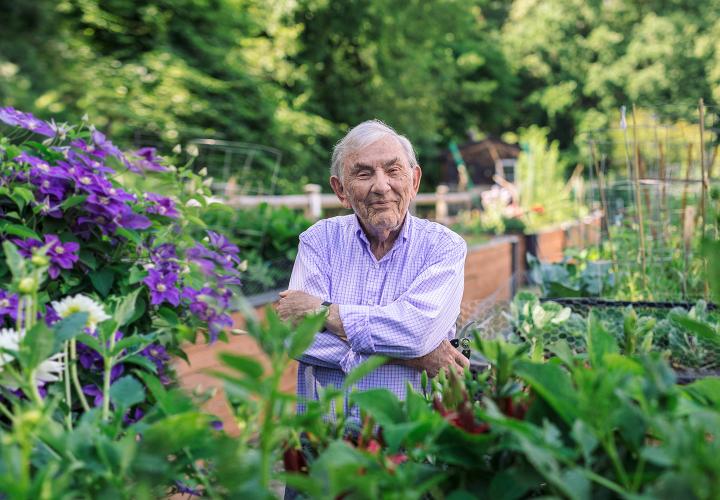 NewBridge on the Charles resident Murray Staub stands outside in his garden.