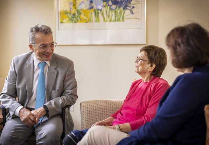 Dr. Alvaro Pascual-Leone of Hebrew SeniorLife’s Wolk Center for Memory Health in Boston speaks with a patient and the patient’s daughter.