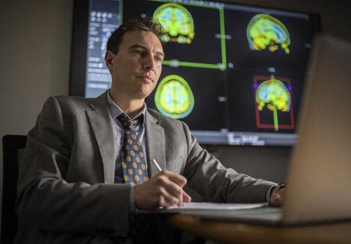 Researcher sitting in front of computer