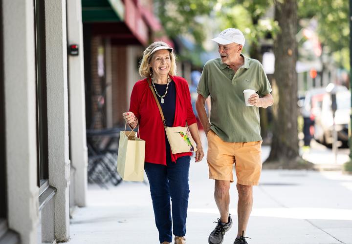 Older couple walking in the city